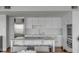 Bright white kitchen with stainless appliances, marble countertops, and island seating at 330 Concord St # 18F, Charleston, SC 29401