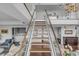 Modern living room with beautiful stairs, bar and comfortable seating areas at 330 Concord St # 18F, Charleston, SC 29401