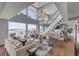 Spacious living room with comfortable seating, stylish decor, and stunning water views at 330 Concord St # 18F, Charleston, SC 29401