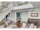 Bright foyer with stairs and hardwood floors leads to an open floorplan and a double-door entrance at 330 Concord St # 18F, Charleston, SC 29401