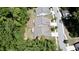 An aerial view of houses with trees and a road at 3997 Aspera Dr, Summerville, SC 29483