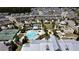 Stunning aerial view showcasing community amenities, including a pool, tennis courts, and clubhouse at 3997 Aspera Dr, Summerville, SC 29483