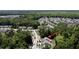 Aerial view showcases property nestled among trees in a neighborhood at 3997 Aspera Dr, Summerville, SC 29483