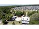 An aerial view of a house complex with beautiful landscaping, trees and clubhouse at 3997 Aspera Dr, Summerville, SC 29483