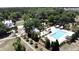 An aerial view of a community pool with trees and buildings at 3997 Aspera Dr, Summerville, SC 29483