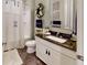 Cozy bathroom with tub and shower, marble countertop, and vanity mirror at 3997 Aspera Dr, Summerville, SC 29483