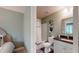 Bright bathroom with a shower-tub combo, granite countertop, and decorative shelves at 3997 Aspera Dr, Summerville, SC 29483