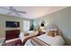 Bright bedroom features two twin beds, a TV, and plenty of natural light at 3997 Aspera Dr, Summerville, SC 29483