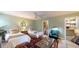 Stylish bedroom featuring two twin beds, unique decor, and an adjacent bathroom and closet at 3997 Aspera Dr, Summerville, SC 29483