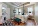 Bedroom features a four-poster bed, wood flooring and ensuite bathroom at 3997 Aspera Dr, Summerville, SC 29483