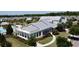 Exterior of community clubhouse with well-maintained landscaping and outdoor seating at 3997 Aspera Dr, Summerville, SC 29483