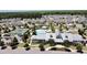 Aerial view of the neighborhood clubhouse, pool, and tennis courts surrounded by many homes at 3997 Aspera Dr, Summerville, SC 29483