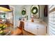 Bright dining area featuring white cabinets, quartz countertop, arched windows and elegant decor touches throughout at 3997 Aspera Dr, Summerville, SC 29483