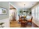 Dining room featuring white cabinets, stainless steel appliances, and bright natural light at 3997 Aspera Dr, Summerville, SC 29483