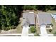 Aerial view of a two-story home with a two-car garage, well maintained landscaping, and mature trees at 3997 Aspera Dr, Summerville, SC 29483