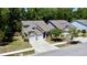 Beautifully landscaped house featuring a two-car garage and a covered front porch at 3997 Aspera Dr, Summerville, SC 29483