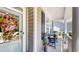 Charming covered front porch with bench seating, plants, and stylish front door with wreath at 3997 Aspera Dr, Summerville, SC 29483
