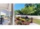Front porch featuring lovely plantings, seating, and exterior view of the neighborhood at 3997 Aspera Dr, Summerville, SC 29483