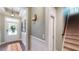Hallway featuring staircase, wainscoting and a welcoming front door at 3997 Aspera Dr, Summerville, SC 29483