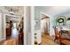 Warm hallway leads to an open kitchen featuring stainless steel appliances and lots of natural light at 3997 Aspera Dr, Summerville, SC 29483