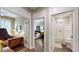 Hallway view of study with french doors, bedroom and bathroom with a shower curtain at 3997 Aspera Dr, Summerville, SC 29483