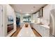 Modern white kitchen with stainless steel appliances and a large island, perfect for cooking and entertaining at 3997 Aspera Dr, Summerville, SC 29483