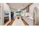 Bright, white kitchen with a large island, stainless steel appliances, and an open layout at 3997 Aspera Dr, Summerville, SC 29483