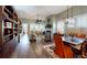 Open-concept living room featuring hardwood floors, a cozy fireplace, and stylish furnishings at 3997 Aspera Dr, Summerville, SC 29483
