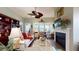 Cozy living room with a fireplace, built-in bookshelves, and large windows offering plenty of natural light at 3997 Aspera Dr, Summerville, SC 29483