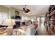 Inviting living room with fireplace, hardwood floors, and custom built-in shelving at 3997 Aspera Dr, Summerville, SC 29483