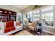 Comfortable living room with large windows, stylish furniture, and a view to the screened porch at 3997 Aspera Dr, Summerville, SC 29483