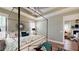 Bright main bedroom featuring tray ceiling, plantation shutters, and hardwood floors at 3997 Aspera Dr, Summerville, SC 29483