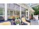 Enclosed patio featuring comfortable seating and a pergola with screen, perfect for relaxing at 3997 Aspera Dr, Summerville, SC 29483