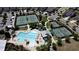 An aerial view of a community pool and tennis courts, with many houses in the background at 3997 Aspera Dr, Summerville, SC 29483