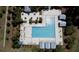 Aerial view of pool featuring lounge chairs, sunshades, and lush surrounding landscape at 3997 Aspera Dr, Summerville, SC 29483