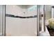 Glass-enclosed walk-in shower with window at 3997 Aspera Dr, Summerville, SC 29483