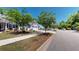 Street view showcasing neighborhood's sidewalk and well-maintained homes with manicured lawns at 3997 Aspera Dr, Summerville, SC 29483