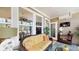 Relaxing sunroom with comfortable seating, a ceiling fan, and plenty of natural light at 3997 Aspera Dr, Summerville, SC 29483