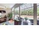 Bright sunroom with a view of the backyard, featuring comfortable seating and a ceiling fan at 3997 Aspera Dr, Summerville, SC 29483
