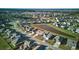 Aerial shot of house, community and adjacent pond; shows proximity to amenities at 413 Ribiero Dr, Summerville, SC 29486