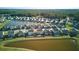Aerial view of homes near a pond showcasing the neighborhood layout at 413 Ribiero Dr, Summerville, SC 29486