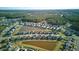 Overhead view of a residential area featuring houses, ponds, and green spaces at 413 Ribiero Dr, Summerville, SC 29486