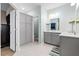 Well-lit bathroom featuring a double vanity, updated lighting, and a neutral color palette at 413 Ribiero Dr, Summerville, SC 29486
