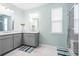 Bright bathroom with double sinks, a large mirror, and a walk-in shower at 413 Ribiero Dr, Summerville, SC 29486