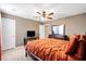 Warm bedroom with orange bedding, soft carpet, and dresser providing a welcoming and comfortable atmosphere at 413 Ribiero Dr, Summerville, SC 29486