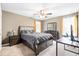 Neutral bedroom showcasing warm walls, carpet, and a full furniture suite including a large bed and dresser at 413 Ribiero Dr, Summerville, SC 29486