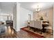 Elegant dining room with a wood table, upholstered chairs, and view into the living room at 413 Ribiero Dr, Summerville, SC 29486
