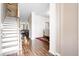Inviting entryway featuring wood floors, staircase, and an open view of the dining and living areas at 413 Ribiero Dr, Summerville, SC 29486
