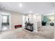 Bright loft area with neutral walls, a red bench, decor table, and desk, providing versatile living space at 413 Ribiero Dr, Summerville, SC 29486