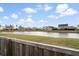 Scenic view of neighborhood pond from fenced-in backyard at 413 Ribiero Dr, Summerville, SC 29486